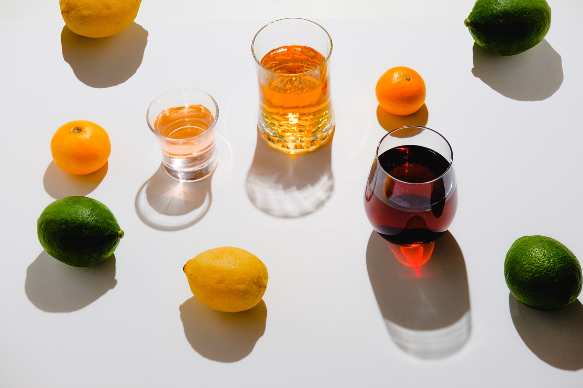 Glasses of Various Drinks with Lemons, Limes and Oranges